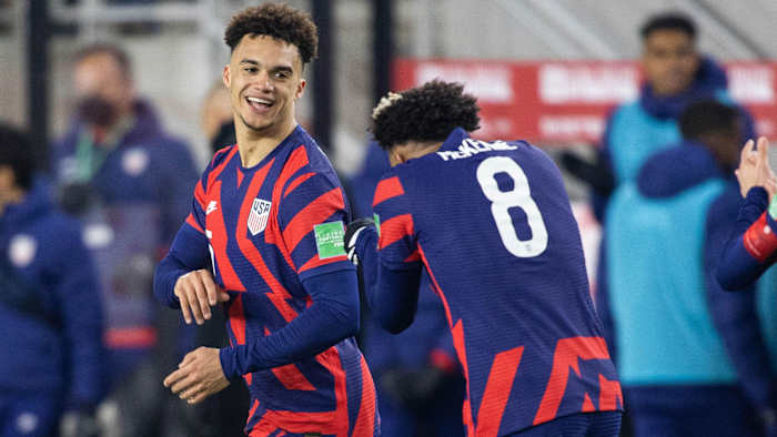 Antonee Robinson and Weston McKennie celebrate the USMNT's goal vs. El Salvador